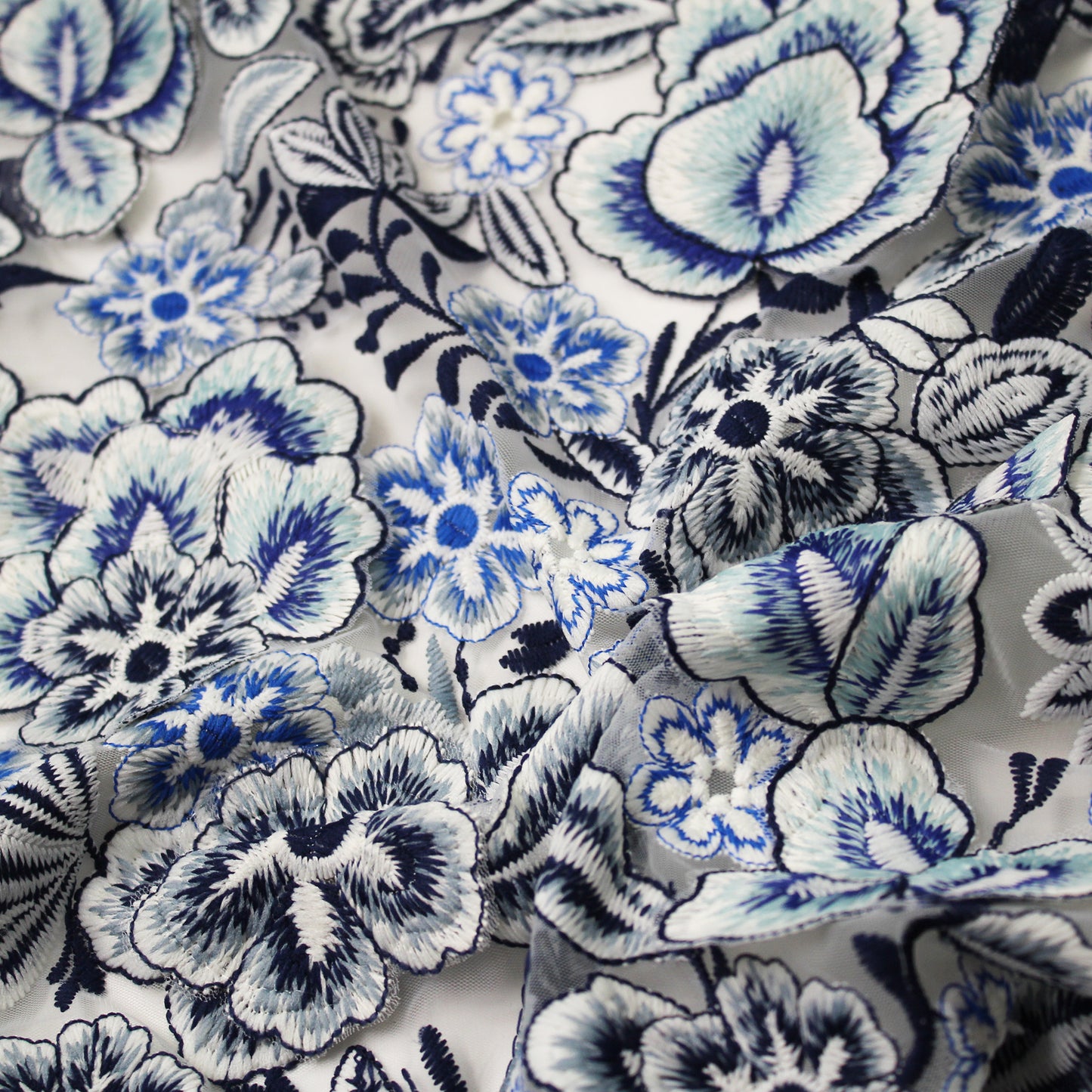 White Embroidered Tulle with Raised Blue Flowers