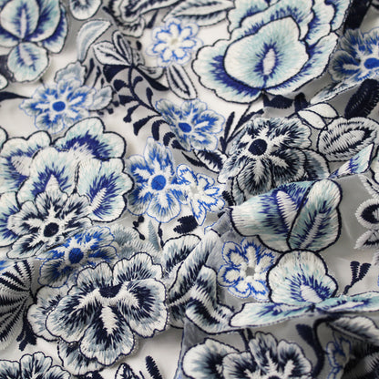 White Embroidered Tulle with Raised Blue Flowers